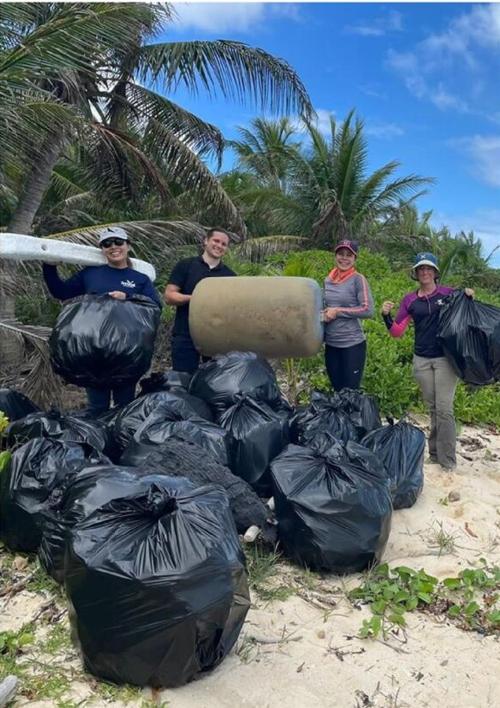 NAVFAC Marianas employees remove trash at Spanish Steps