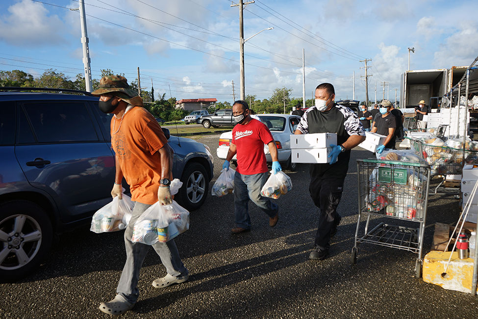 Residents line up before sunrise for food distribution Guam News