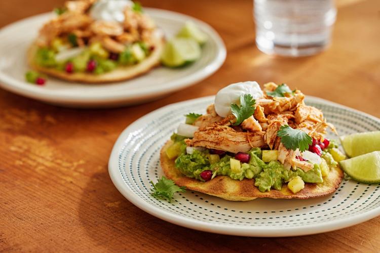 Baked chicken tostadas with guacamole are a fun, healthful dinner