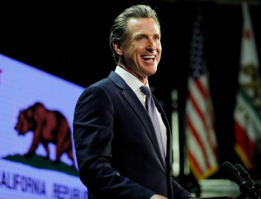 California's new governor takes aim at Trump as he takes office