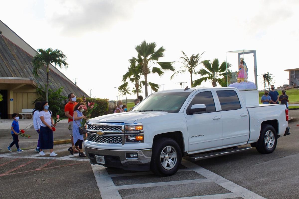Thousands greet patron saint's drive around the island