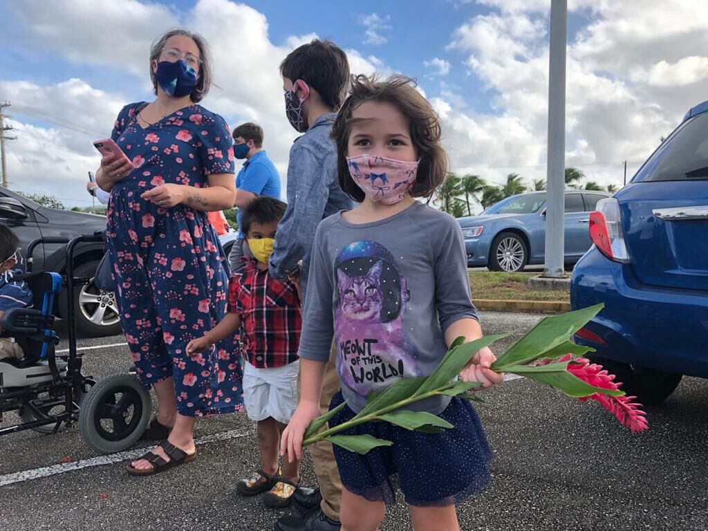 Thousands greet patron saint's drive around the island