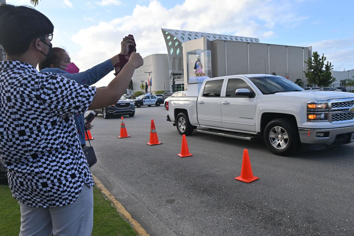 Thousands greet patron saint's drive around the island
