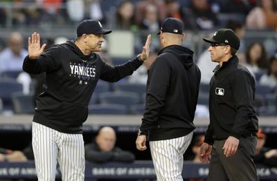 Aaron Boone signs three-year deal to return as Yankees manager