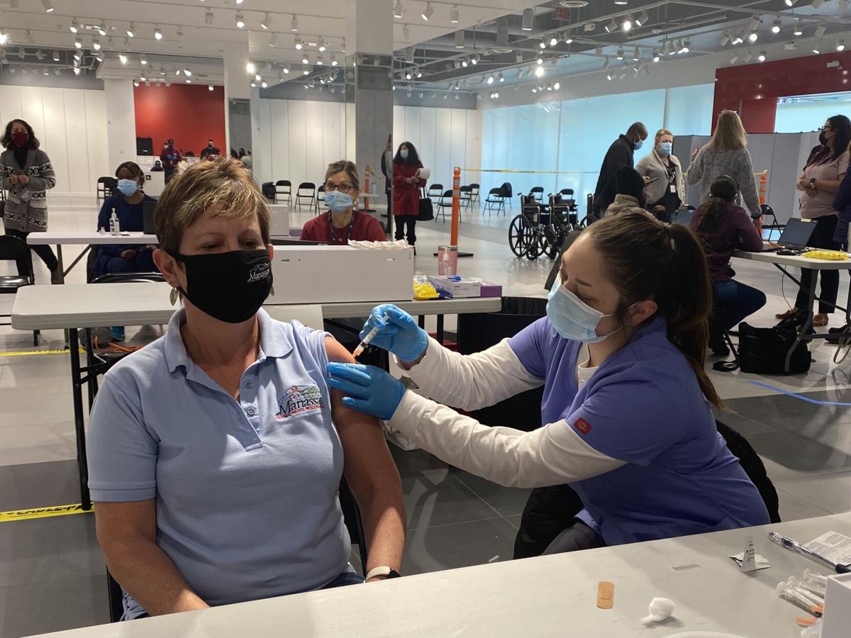Prince William Vaccine / Prince William wears face mask to visit vaccine volunteers / But his arm got more attention.