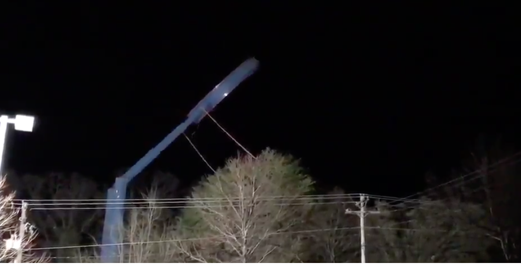 VIDEO: In the end, tow trucks pull down Potomac Mills sign