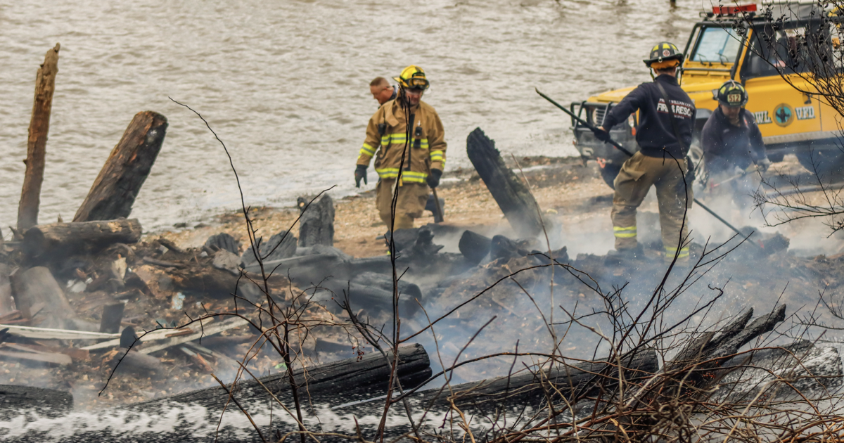 Debris fire near the former Tim's Rivershore restaurant briefly halts ...