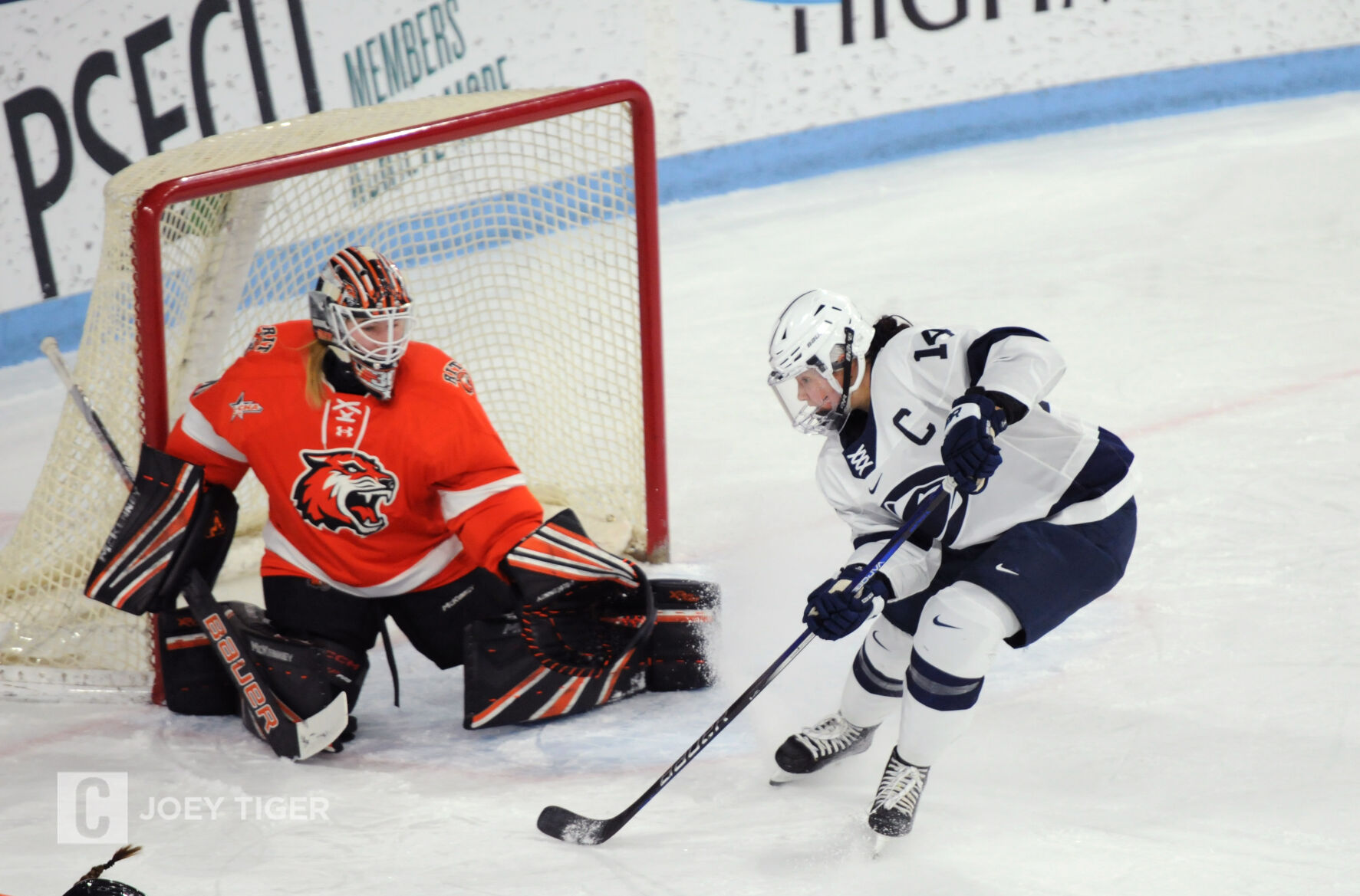 Women s hockey pushes past RIT clinches top seed in CHA