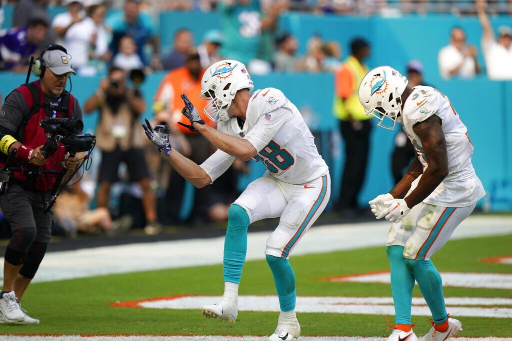 Miami Dolphins tight end Mike Gesicki (88) runs on the field