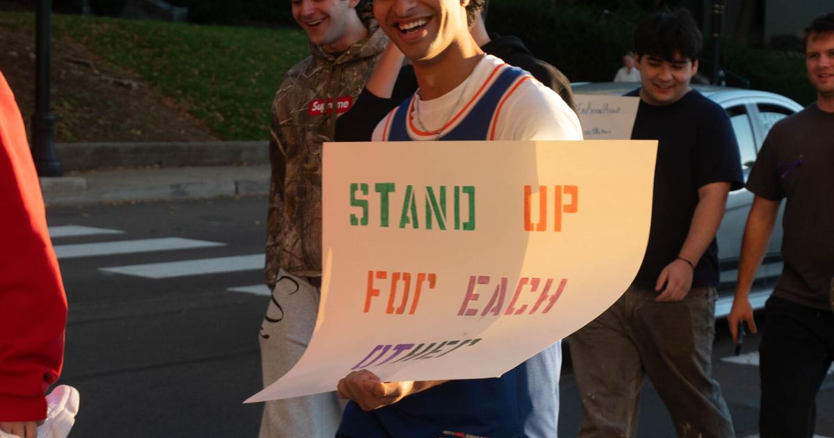 Footwear Checklist.pdf walk a mile in her shoes, student with sign | | psucollegian.com