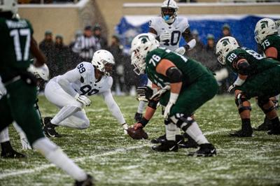 Coziah Izzard (99) meets Michigan State offense