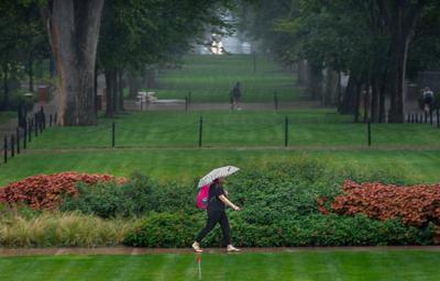 Student walks in the rain