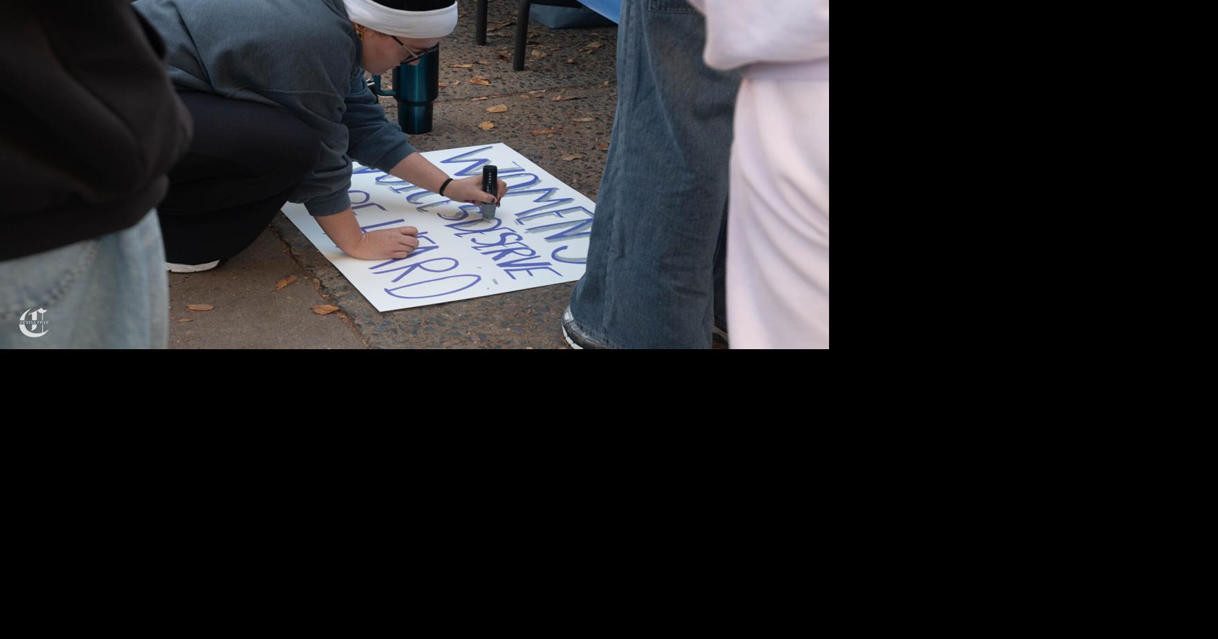 walk a mile in her shoes, making sign | | psucollegian.com