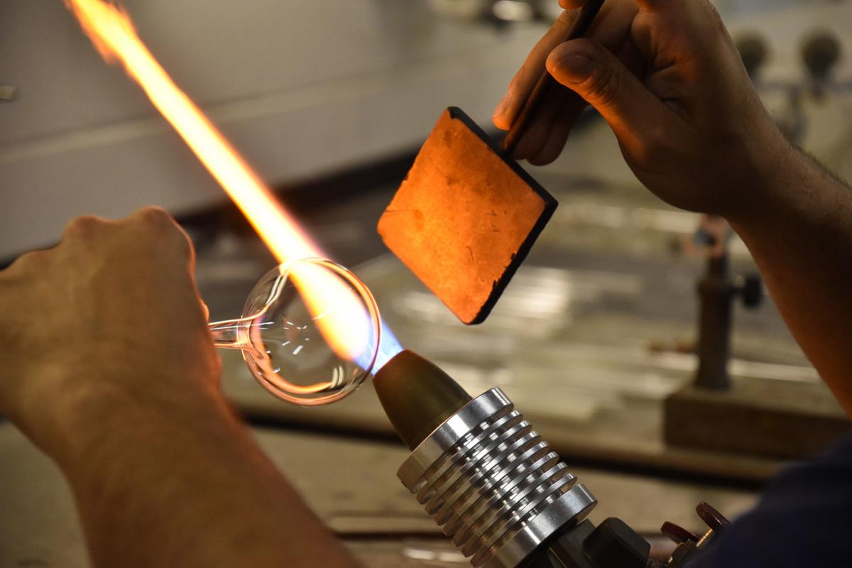 Scientific Glassblower Demonstrates Art At Glass Lab Campus