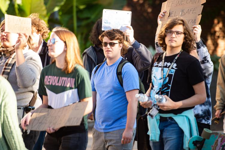 Students rally in support of MeToo movement, Ted Hardesty walks with protesters