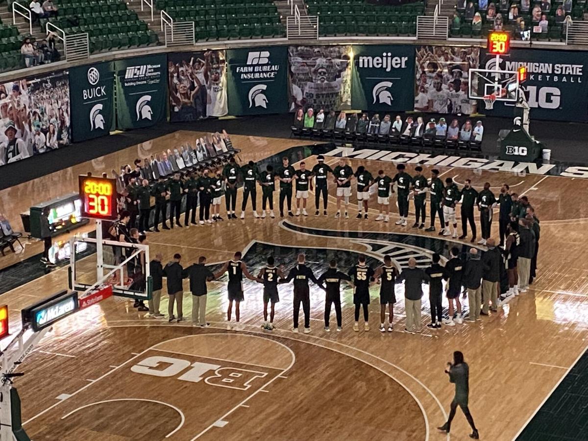 Michigan State, Purdue players stand in unity before ...