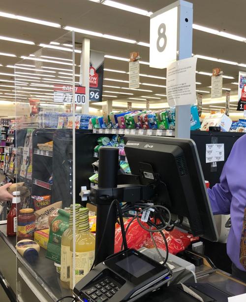 Hy-Vee plexiglass wall at checkout lanes