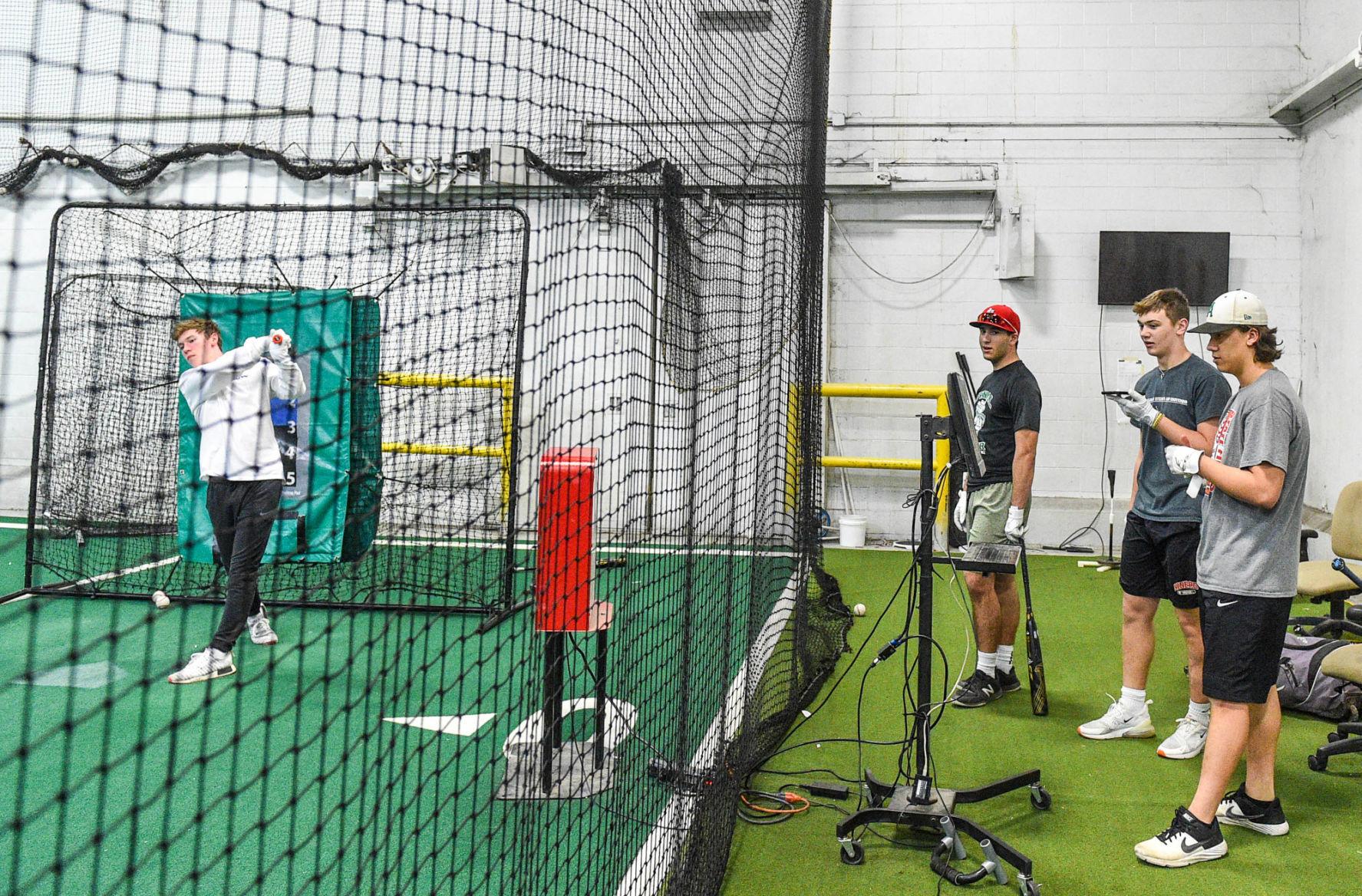 Photos High School baseball players practice batting at Fielder's Choice