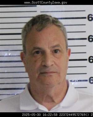 Former Genesis administrator charged with indecent contact with a child