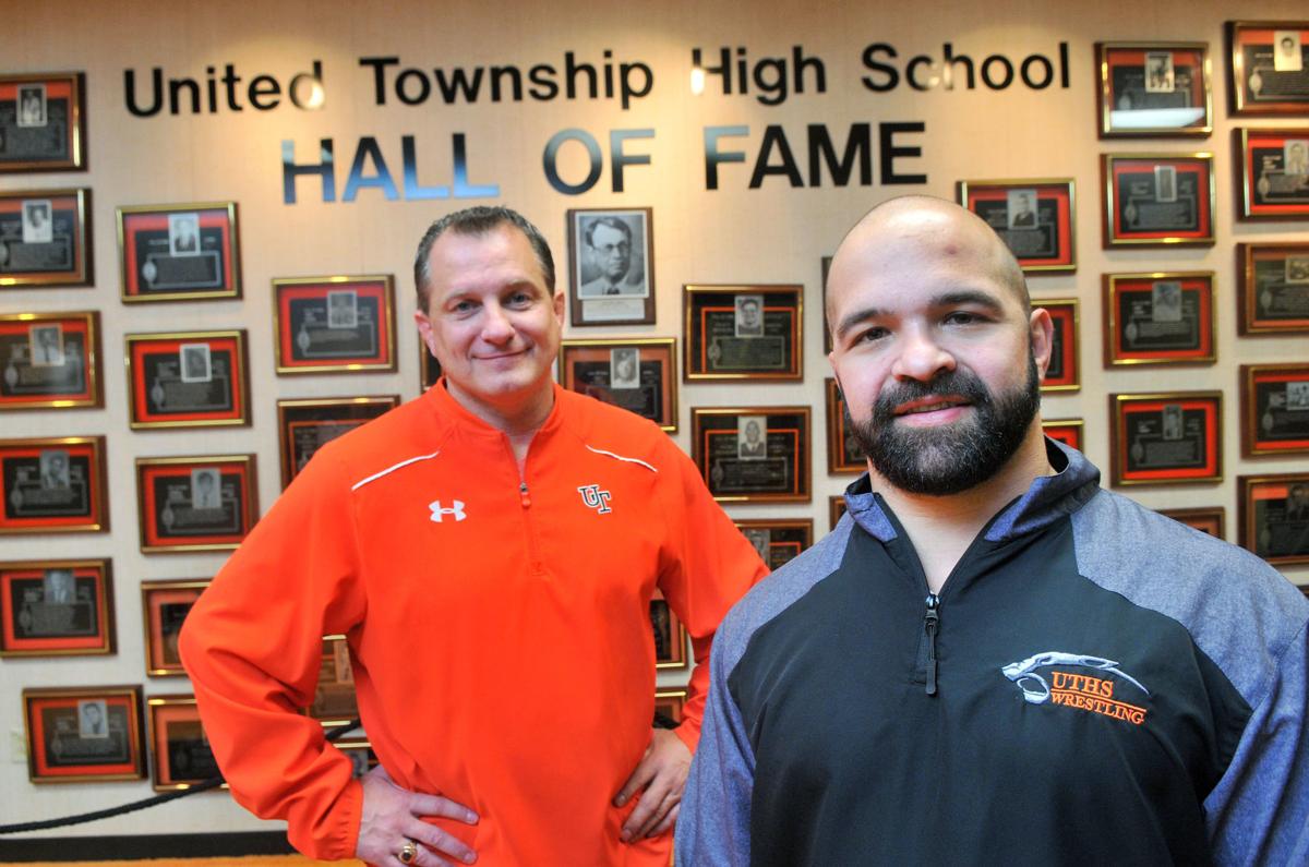 United Township's anthletic director Mark Pustelnik and wrestling coach Lambros Fotos
