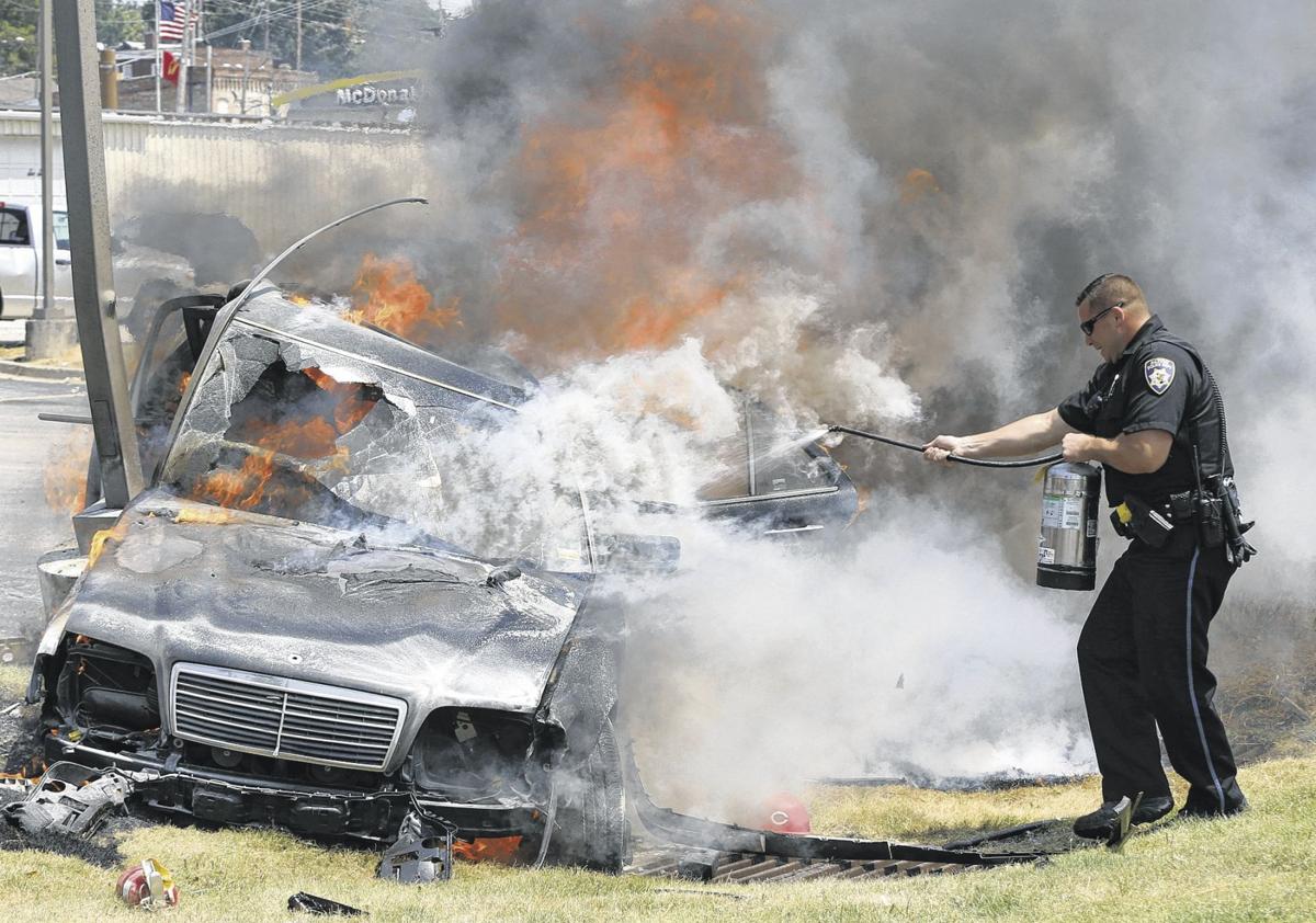 Man, boy rescued from fiery crash in Alton