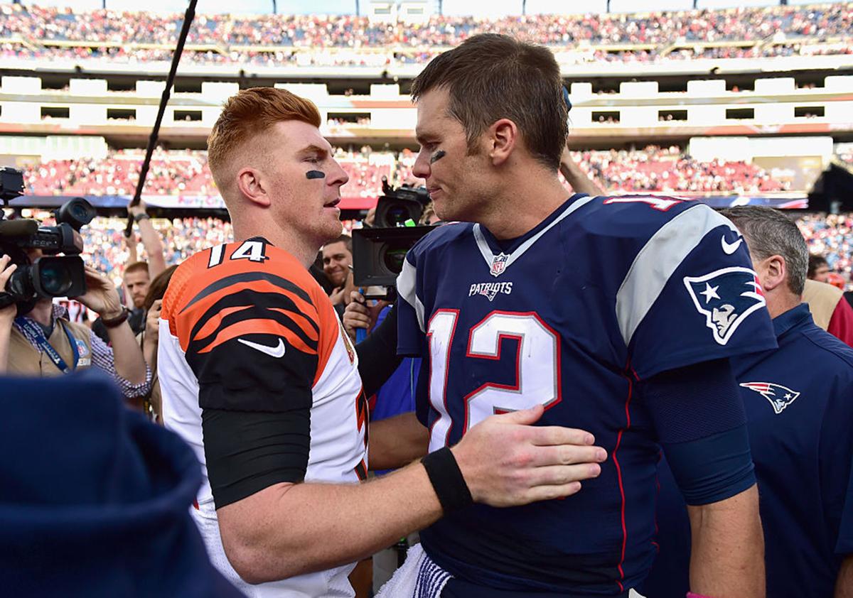 Tom Brady #12 of the New England Patriots reacts with Andy Dalton #14 of the Cincinnati Bengals following a game against the Cincinnati Bengals at Gillette Stadium on October 16, 2016 in Foxboro, Massachusetts.