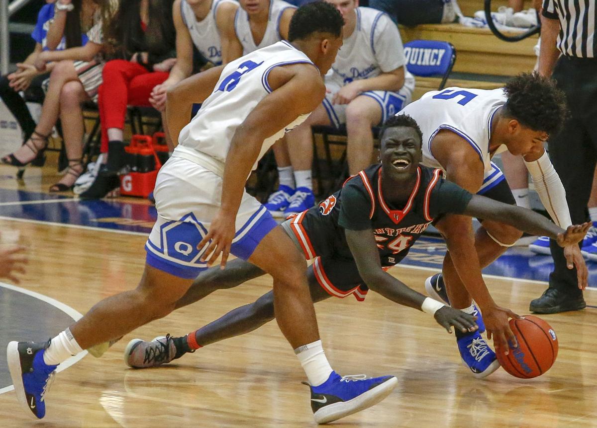 UT stumbles late at Quincy Basketball