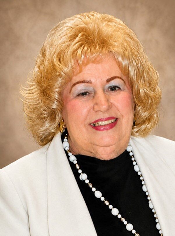 Portrait of Donna Hymes reflecting on her community impact