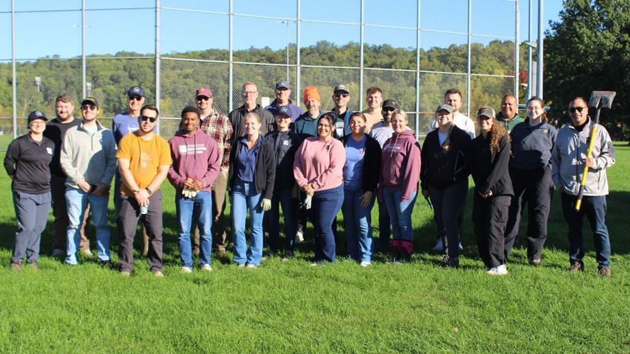HNI volunteers assist City in planting urban trees