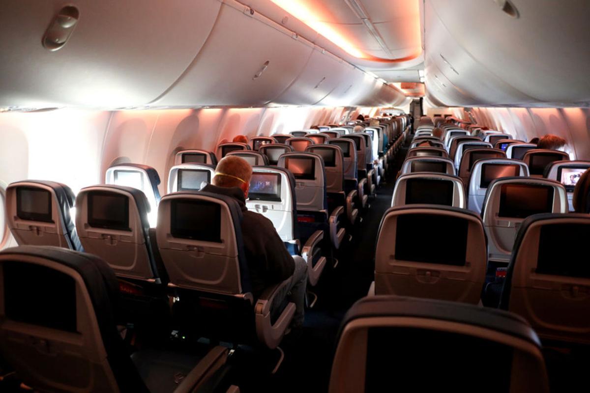 Passengers are seen in a cabin mid-flight on a Baltimore, Maryland bound Delta flight from Hartsfield-Jackson Atlanta International Airport on April 20, 2020 in Atlanta, Georgia.
