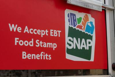 Logansport - Circa June 2020: SNAP and EBT Accepted here sign. SNAP and Food Stamps provide nutrition benefits to supplement the budgets of disadvantaged families.