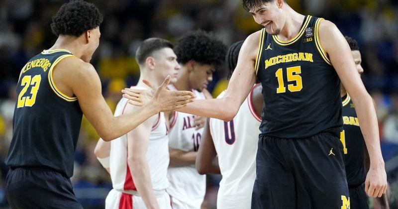 Michigan Wolverines center Aday Mara (15) and forward Yaxel Lendeborg (23) celebrate a made basket Saturday, April 4, 2026, during a Final Four game against the Arizona Wildcats at Lucas Oil Stadium in Indianapolis.