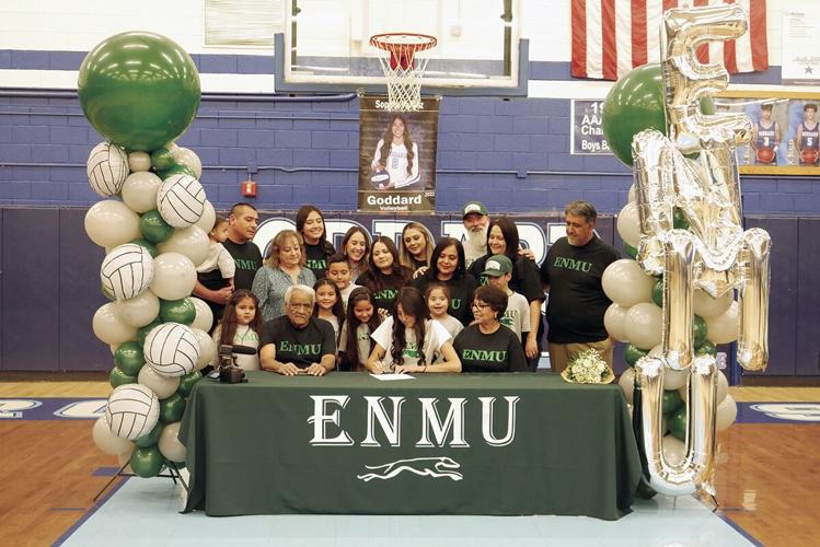 Sophia Valdez signing to Eastern New Mexico University with her parents and extended family