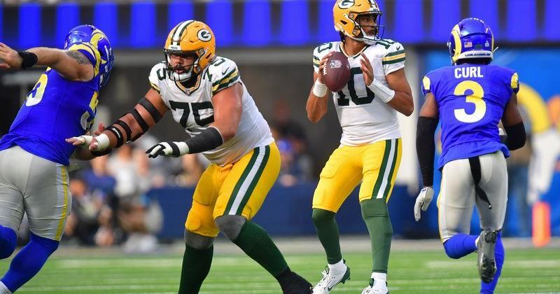 Oct 6, 2024; Inglewood, California, USA; Green Bay Packers quarterback Jordan Love (10) drops back to pass as Los Angeles Rams safety Kamren Curl (3) moves in during the second half at SoFi Stadium. Mandatory Credit: Gary A. Vasquez-Imagn Images