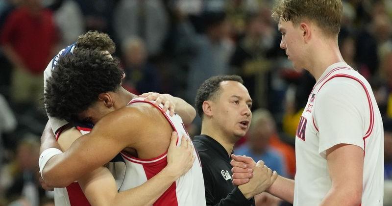 Arizona Wildcats forward Koa Peat (10) and Arizona Wildcats center Motiejus Krivas (13) react in the second half during a semifinal of the Final Four of the men's 2026 NCAA Tournament against the Michigan Wolverines at Lucas Oil Stadium