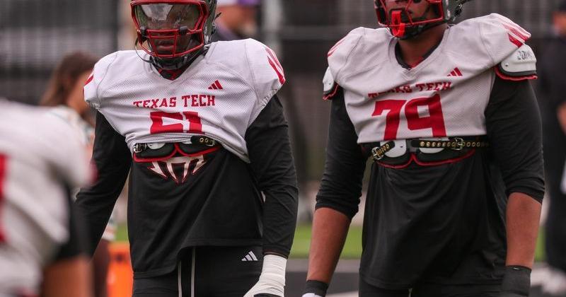 Texas Tech players Felix Ojo (left) and Howard Sampson go through a drill during spring football practice, Tuesday, March 31, 2026, at the Womble Football Center.