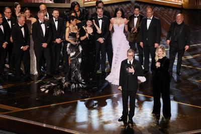 Paul Thomas Anderson and Sara Murphy accept the Oscar for best picture for "One Battle After Another" during the 98th Annual Academy Awards, held by the Academy of Motion Picture Arts and Sciences, at the Dolby Theatre in Hollywood, California, Sunday, ...