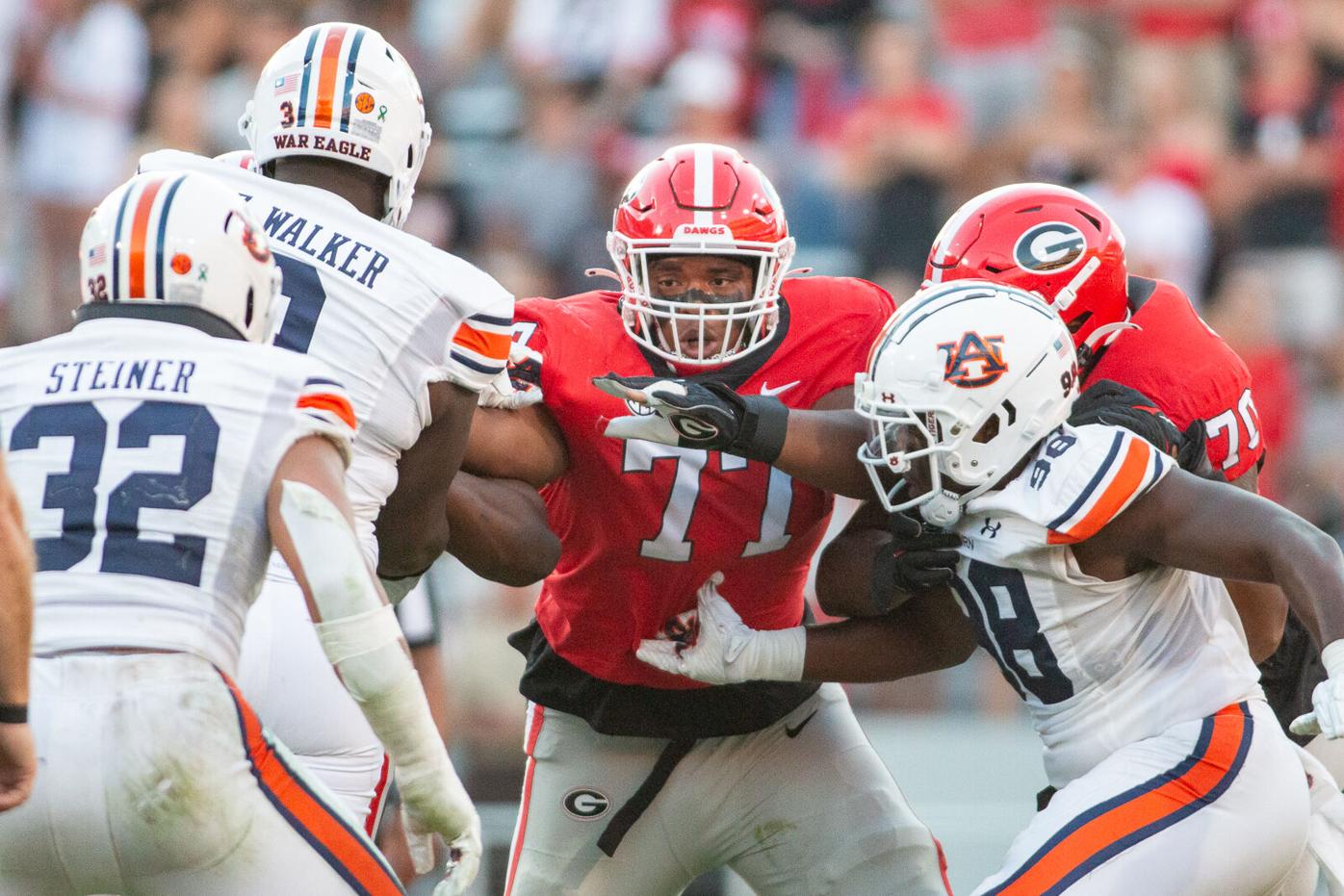 Georgia football player Devin Willock, staff member Chandler