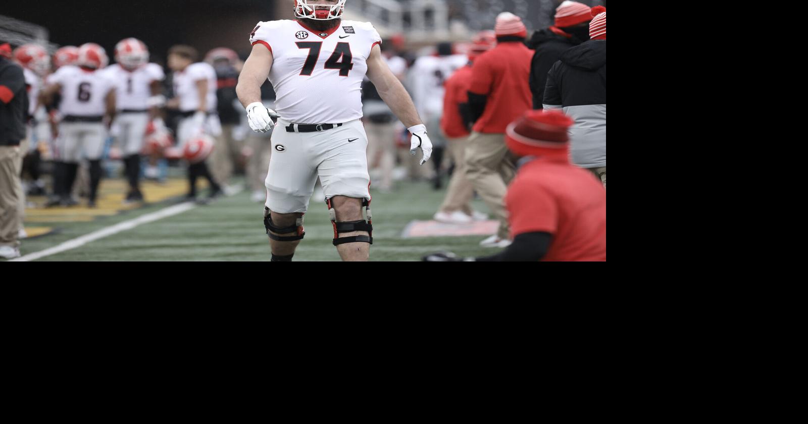 Baltimore Ravens guard Ben Cleveland (66) heads out to the field