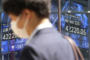Asian shares decline following Wall Street's dip