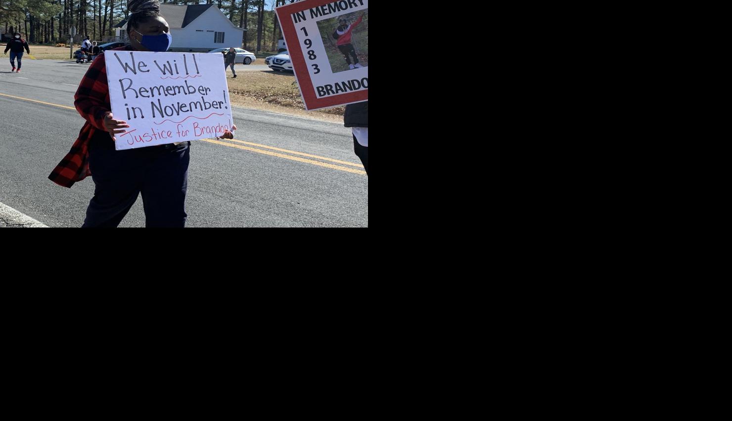 Supporters of man shot in Grimesland march in neighborhood where he was