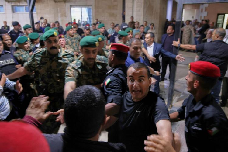 Reflector Blocking Gunmen open fire at a church during a funeral in Jordan, killing 7 and ...
