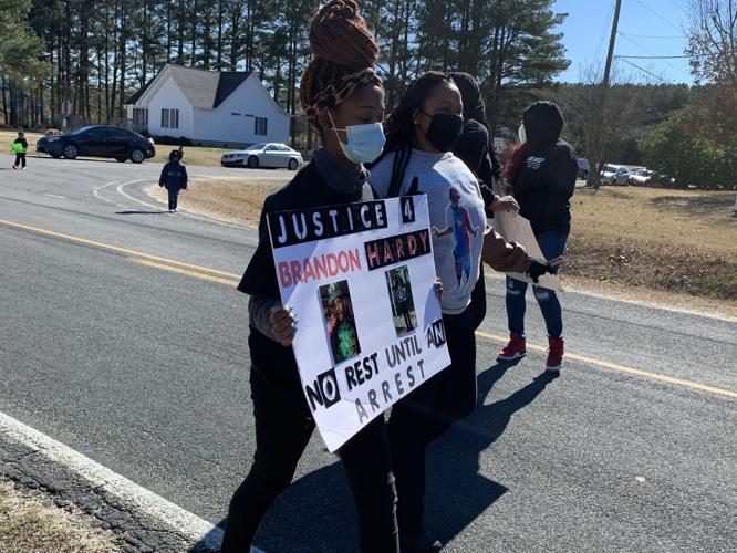 Supporters of man shot in Grimesland march in neighborhood where he was