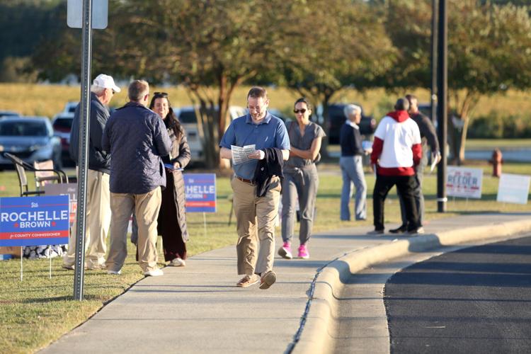 Voters brave long lines; campaigns parade into Pitt County Local News