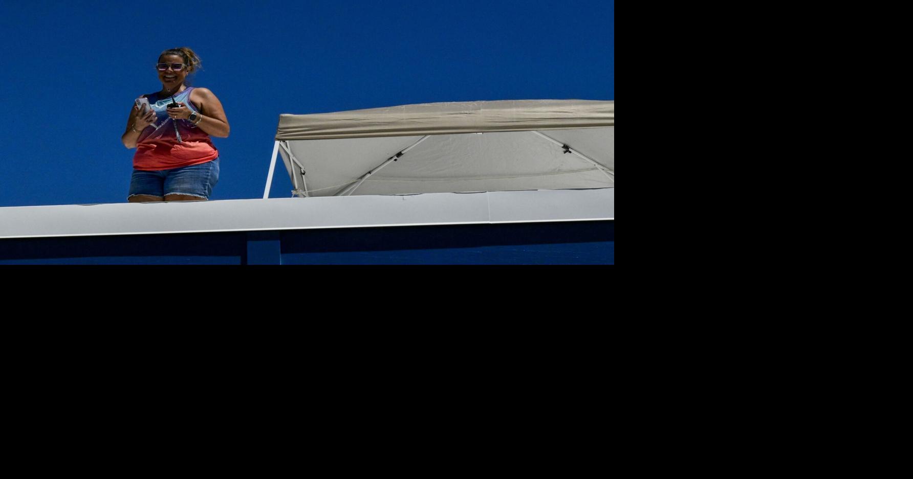 Why is she on the roof? Principal goes 'above and beyond' after students meet academic challenge