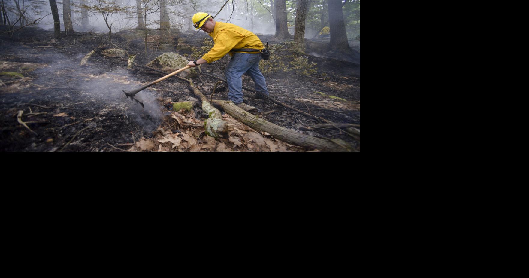 A hot day to be fighting a brush fire in Hinsdale, NH, at Pisgah State