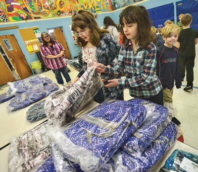 New Year's surprise: New backpacks for all at Jamaica Village School