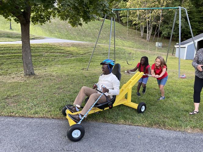 Big & little kids enjoying push carts.jpg