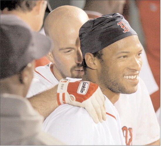 Former infielder Mike Lowell of the Boston Red Sox smiles during