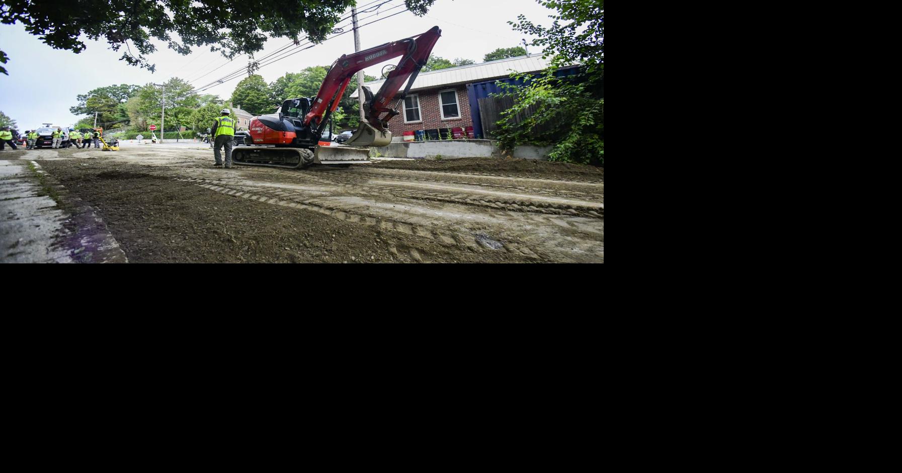 Water main break causes sidewalk, road damage